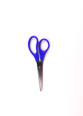 blue scissors on a white background. isolate