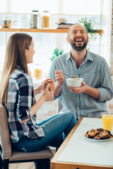 Laughing at the funny joke during the meal stock photo