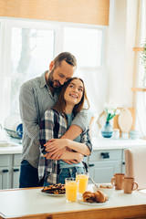 Dreamy lady standing with her boyfriend stock photo