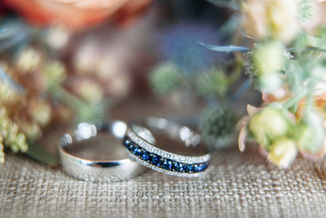 White gold wedding rings on linen fabric