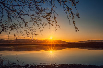 Morning sunrise on Lake Imandra. Against the backdrop of the Khibiny Mountains, Murmansk Region, Kola Peninsula.