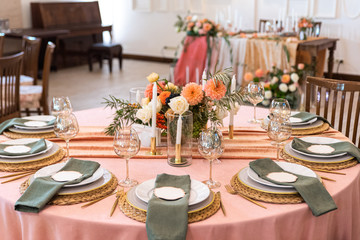 Elegant decor of a wedding bank in peach and green