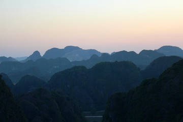 Amazing sunset at Tam Coc, the known as the Halong Bay on land.