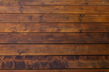 Stained wet deck wooden boards with water drops texture