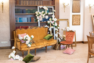 Antique sofa and armchair with bookshelves