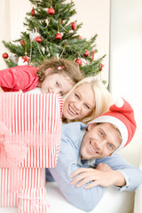 Obraz na płótnie Canvas Happy family enjoying Christmas atmosphere