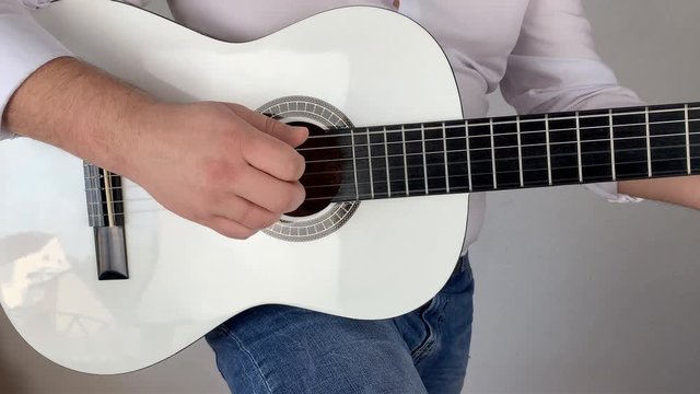man in white shirt plays six-string classical guitar at home, concept art