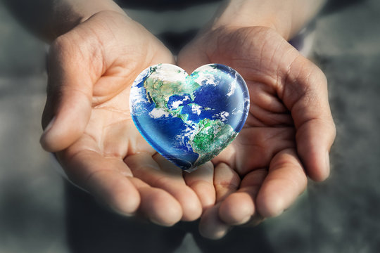 Hand holding Heart Shape Earth,  Love Green Enviroment and Earth Day concept, Elements of this image furnished by NASA
