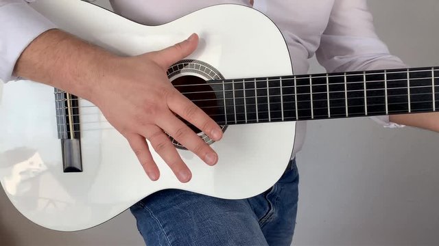 man in white shirt plays six-string classical guitar at home, concept art