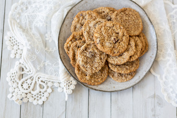 Oatmeal cookies on plate with lace and wood