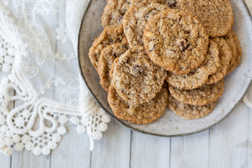 Oatmeal cookies on plate with lace and wood
