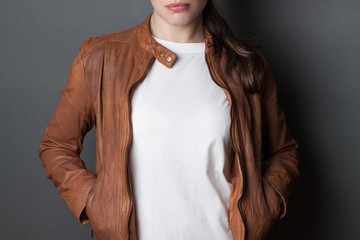 young woman  in white  t-shirt  and brown leather jacket studio shot, t shirt mock up