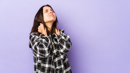 Fototapeta premium Young mixed race hispanic woman isolated suffering neck pain due to sedentary lifestyle.