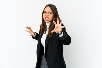 Young mixed race business woman isolated on white background upset screaming with tense hands.