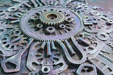 Machine gear, metal cogwheels, nuts and bolts and keys.Selective focus.