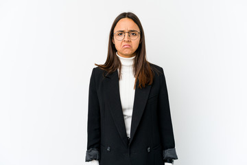 Young mixed race business woman isolated on white background sad, serious face, feeling miserable and displeased.