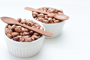 Raw bean grains (Phaseolus vulgaris) displayed in bowl