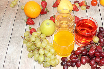 Fruit cocktail, cider, grape juices or fruit drinks in glasses and ingredients on a sunny table. The concept of detox diet and weight loss, healthy and natural nutrition, bar. Healthy breakfast, 