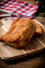 Two fried cod fillet pieces.
