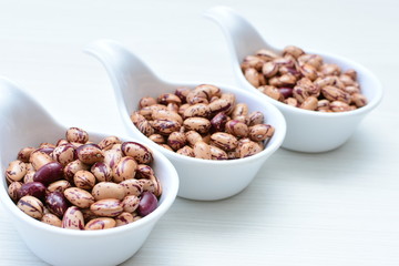 Raw bean grains (Phaseolus vulgaris) displayed in bowl