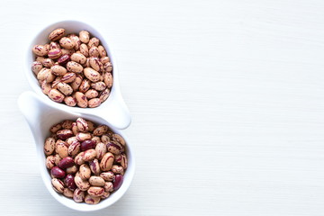 Raw bean grains (Phaseolus vulgaris) displayed in bowl