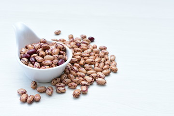 Raw bean grains (Phaseolus vulgaris) displayed in bowl