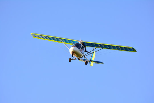 Light engine plane soars above the clouds
