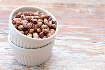 Raw bean grains (Phaseolus vulgaris) displayed in bowl