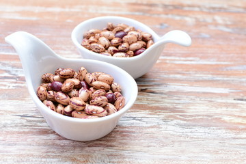 Raw bean grains (Phaseolus vulgaris) displayed in bowl