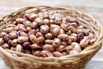 Raw bean grains (Phaseolus vulgaris) displayed in bowl