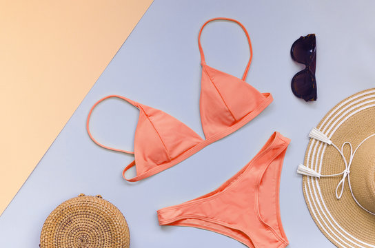Swimming suit with sunglasses, bag and straw hat for summer. Flatlay