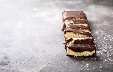 Raw homemade chocolate coconut dessert bounty. Healthy vegan food concept.