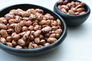 Raw bean grains (Phaseolus vulgaris) displayed in bowl