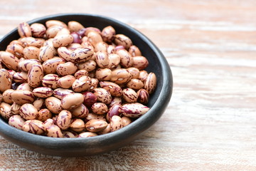 Raw bean grains (Phaseolus vulgaris) displayed in bowl