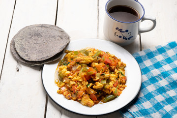 Mexican scrambled eggs with tomato and chili pepper also called 