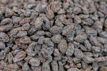 Background and texture of black raisins.