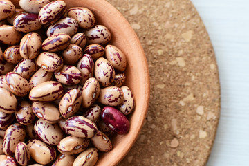 Raw bean grains (Phaseolus vulgaris) displayed in bowl