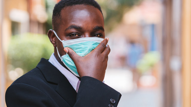 African businessman with medical mask for protect from corona virus or covid-19 ,16:9 style