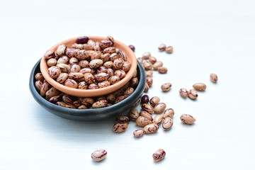 Raw bean grains (Phaseolus vulgaris) displayed in bowl