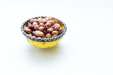 Raw bean grains (Phaseolus vulgaris) displayed in bowl
