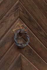 old weathered wooden door knocker