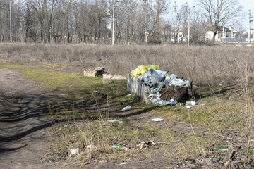Garbage in forest. People illegally thrown garbage into forest. Concept of man and nature. Illegal...