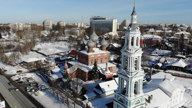 Slow cinematic flight by the Russian Church ("Church of the Resurrection on the Debra") in Kostroma on a clear winter day. View of the Church, bell tower and city.