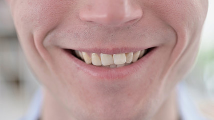 Close Up of Smiling Young Man Lips and Teeth
