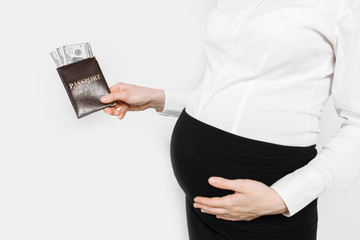 Pregnant woman holding passport with money, waiting for vacation