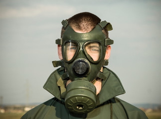 environmental disaster man wearing gas mask