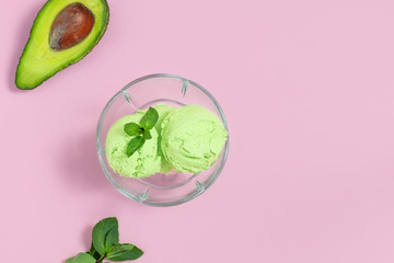 Avocado ice cream, easy recipe with avocado, frozen banana, mint leaves on light pink background