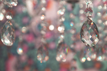 Festive background with sparkling crystal chandelier pendants