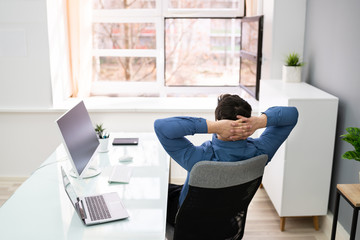 Businessman Relaxing On Chair