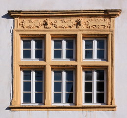 Fototapeta na wymiar Renaissance window frame at the Amtshaus building facade in the old town of Trier Pfalzel in Germany